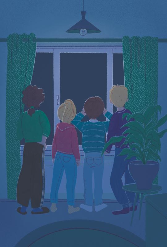 View from behind of four children peering out a window at night in a dark room.